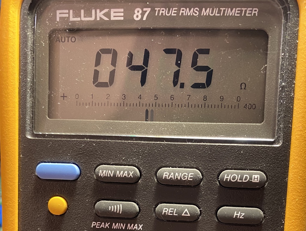 Multimeter showing a measurement of 47.5 ohms.