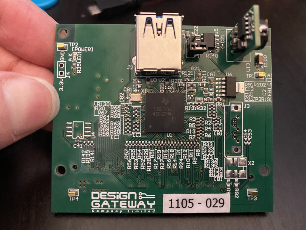 The PHY board, which features a notable long span of resistors, neatly tucked in parallel.