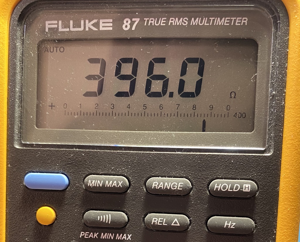Multimeter showing a measurement of 396.0 ohms.